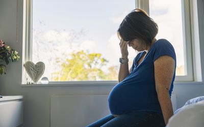 Pregnant woman at home