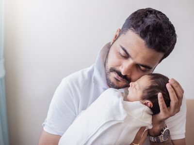 Father holding his newborn baby