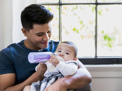 bipoc-man-babysitting-baby