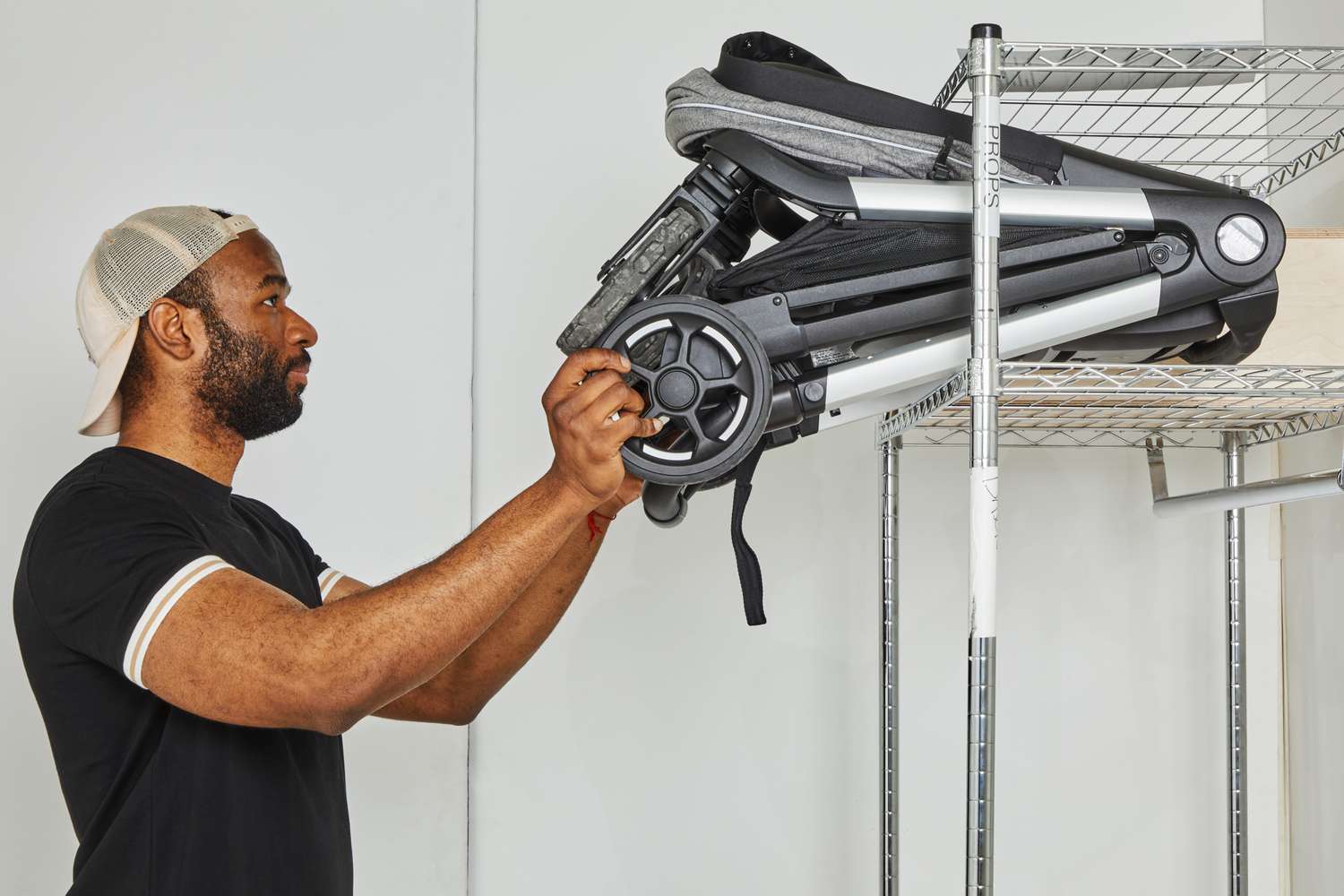 Packing away the Thule Shine running stroller on a shelf