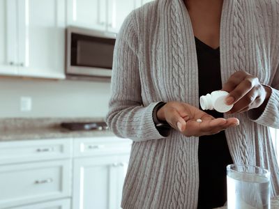 Woman taking medication