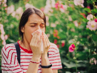 Woman sneezing