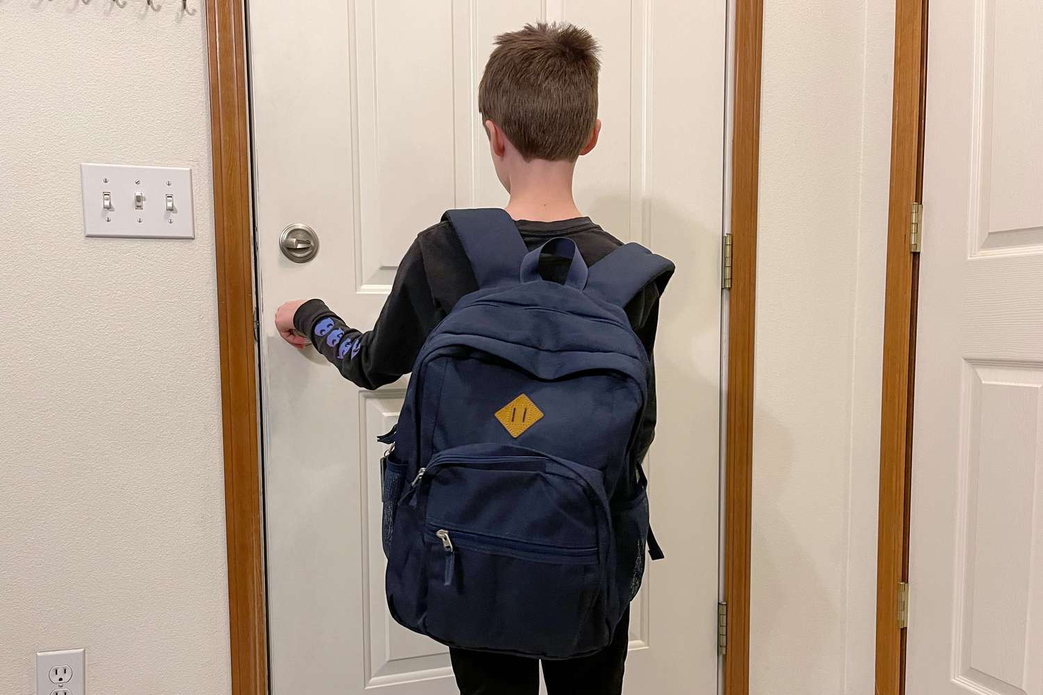 Person wearing Abshoo Classical Basic Travel Backpack For School standing in-front of door