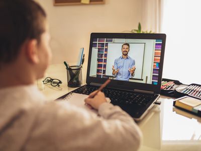 young boy with online tutor