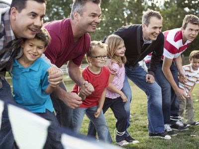 Parents and kids lined up to start 3 legged race.