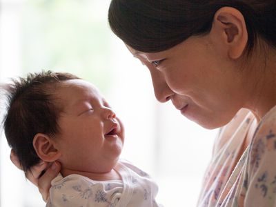 Mom holding baby's head up