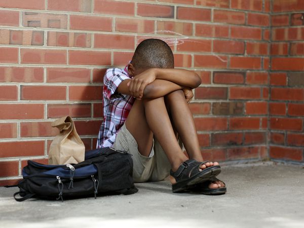 Black boy alone at school