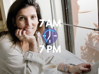 woman smiling next to window