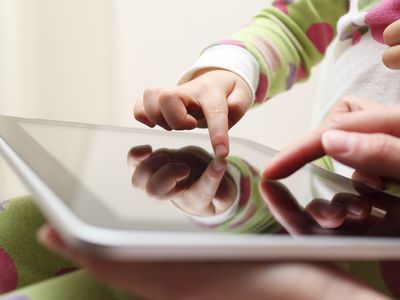 kid touching screen