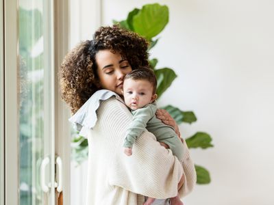 Mom burping baby