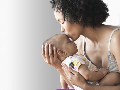 mom kissing baby