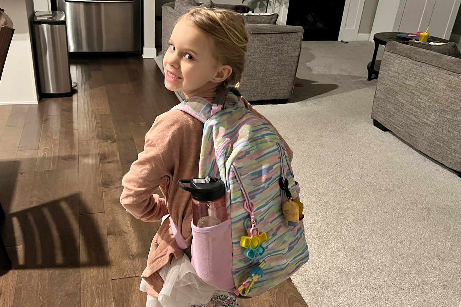 Kid wearing Lands End Kids ClassMate Small Backpack and looking back