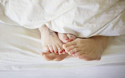 A couple in bed.