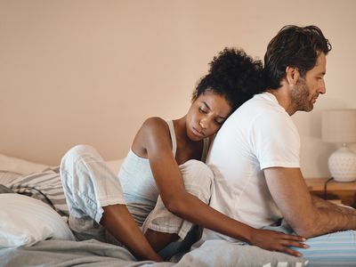 A couple comforts one another
