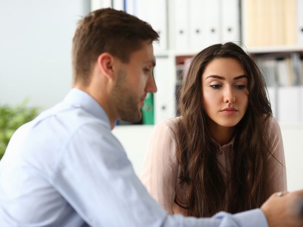 man and woman thoughtfully considering options