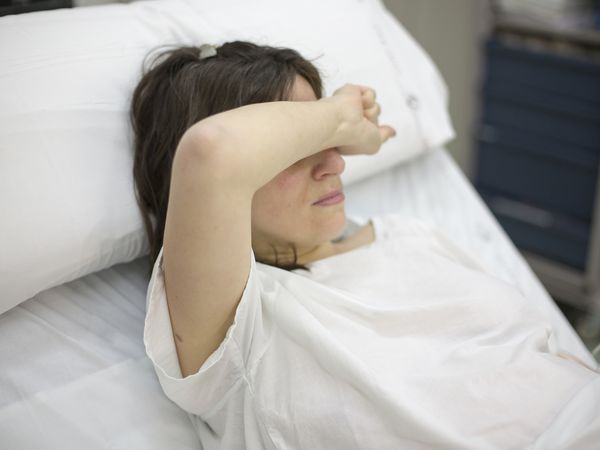Woman in hospital bed
