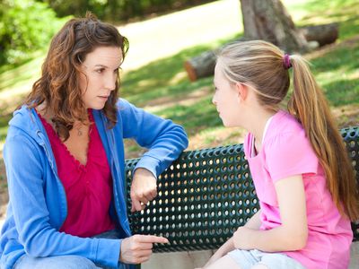 Concerned mother talking with her daughter