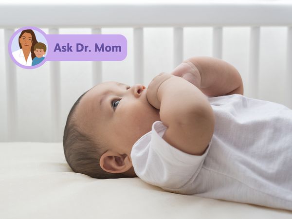 Baby lying in crib
