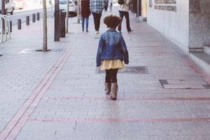 Little girl alone in the city
