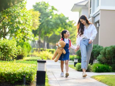 mom and daughter walking