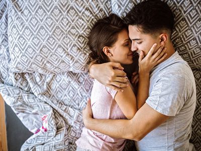 Couple in bed embracing