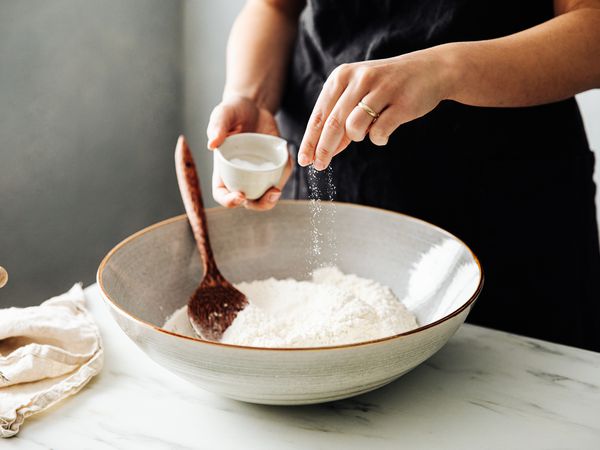Sprinkling salt in a bowl