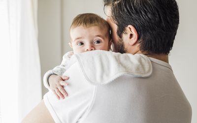 Baby on dad's shoulder