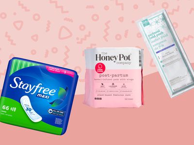 A variety of pads for postpartum bleeding on a pink background