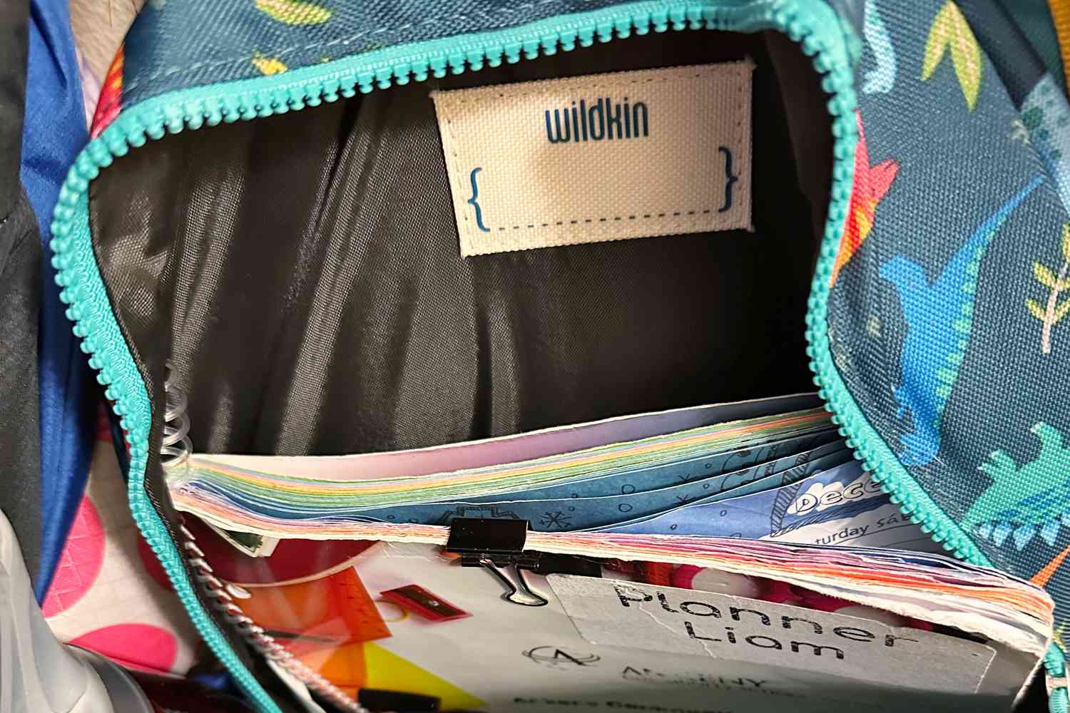 Wildkin Pack-it-All Backpack filled with book and zip kept open