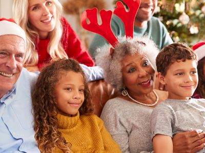 multi-generation family watching Christmas movie