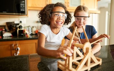 Girls Playing with Science Kit