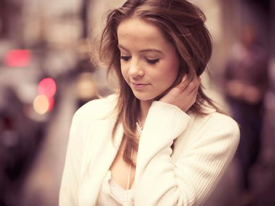 Shy teen girl looking down at ground