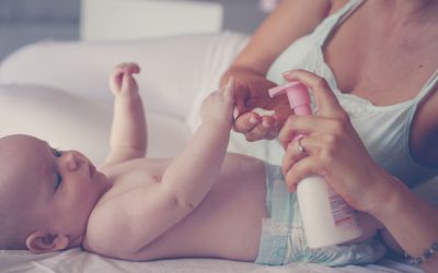 Mother with her baby by at home