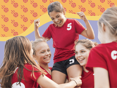 Children in matching sports uniforms cheering