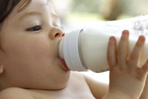 A baby drinking milk from a bottle