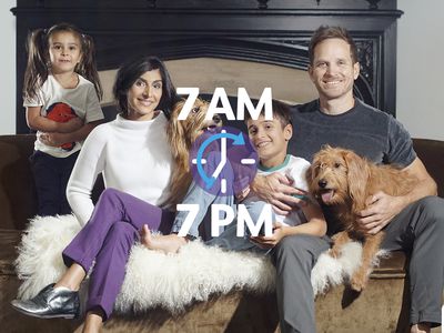 family sitting on bed