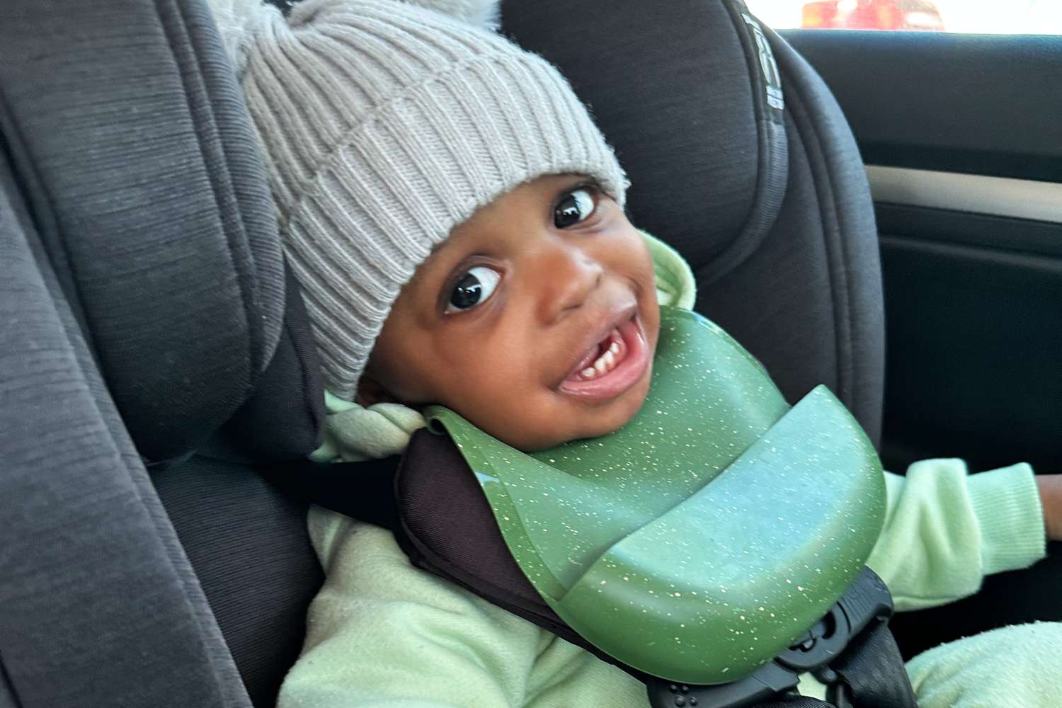 Child sitting in the Chicco OneFit ClearTex All-in-One Car Seat