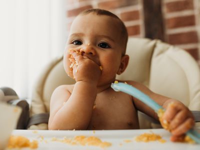 Baby eating in high chair