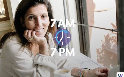 woman smiling next to window