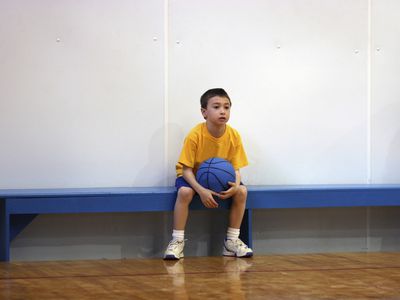 hate sports - boy sitting on bench