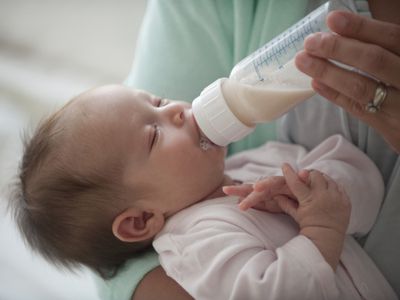 Latino, hispanic, mother feeding newborn baby girl