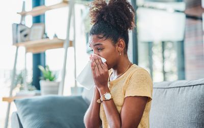 Woman sneezing