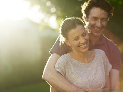 Happy loving couple in park