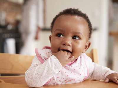 baby sitting in high chair