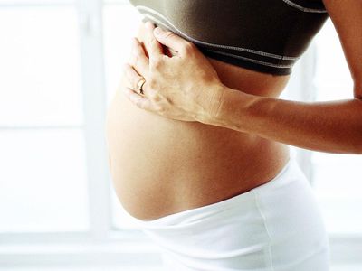 close-up of the stomach of a pregnant woman