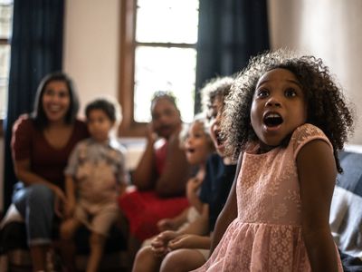 Family watching a movie together