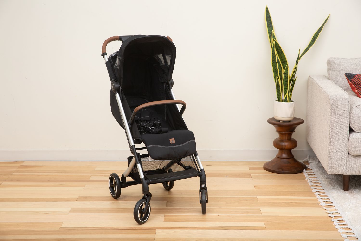 的GB Qbit+ All City stroller sitting unfolded in a room