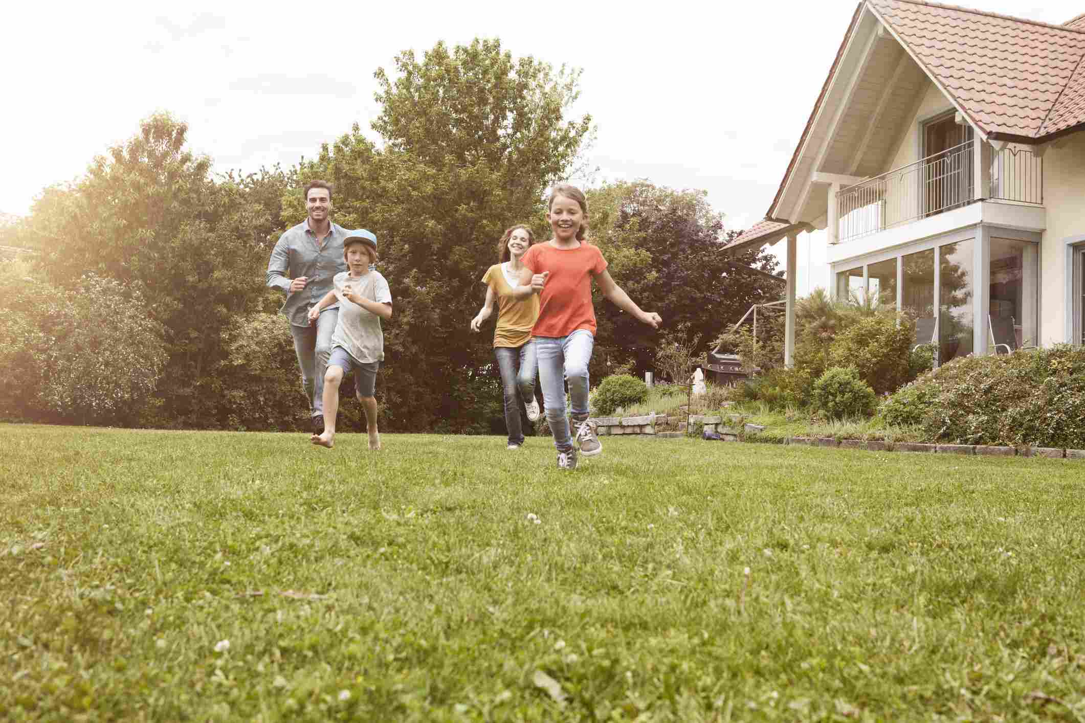 A family playing in a backyard