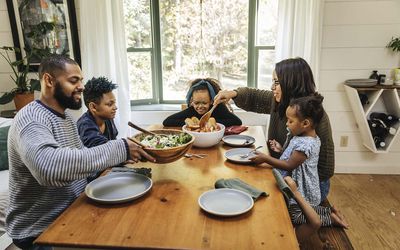 High angle view of family having meal together