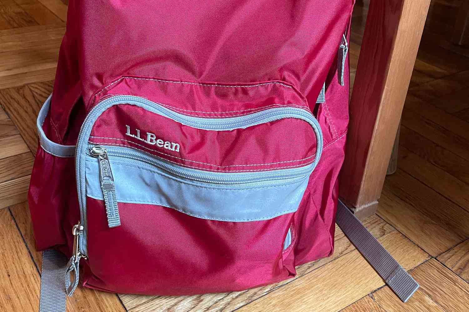 Close-up of L.L.Bean Original Book Pack placed on wooden floor